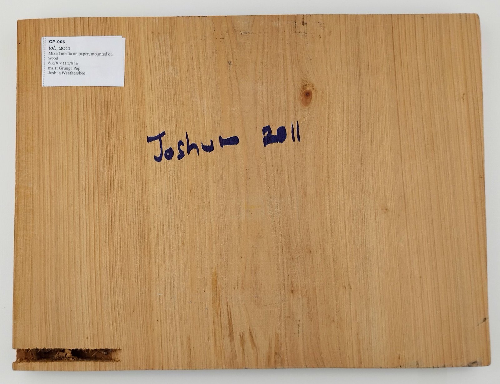 Back of lol., showing signature and label