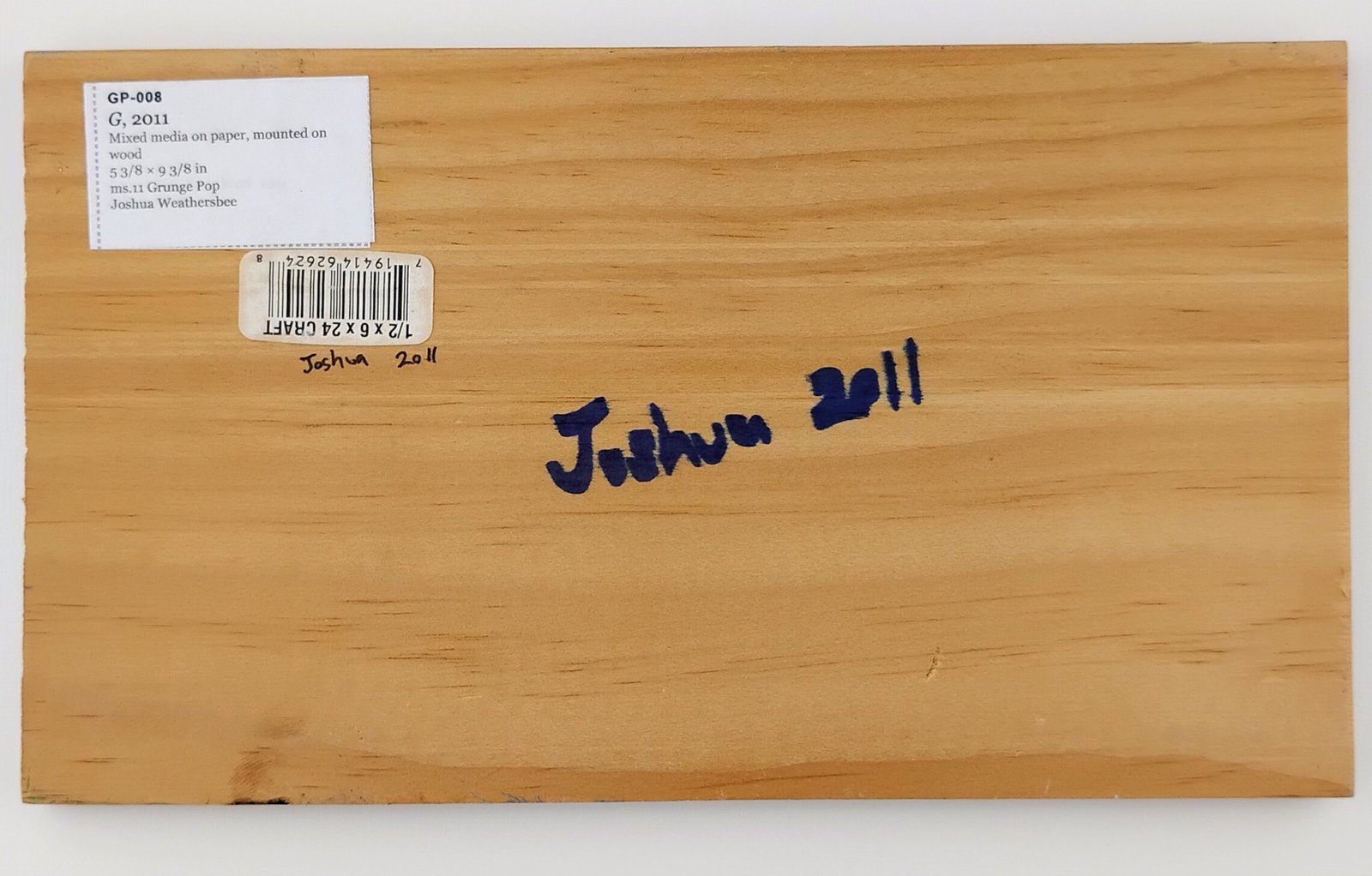 Back of G, showing signature and label