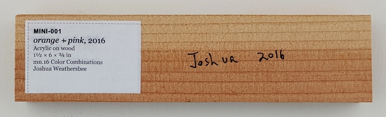Back of orange + pink, showing signature and label