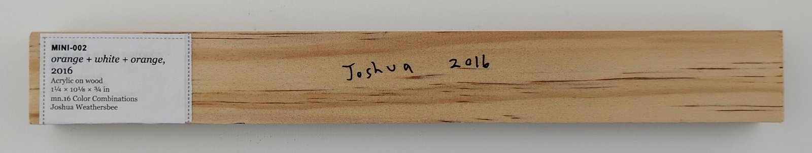Back of orange + white + orange, showing signature and label