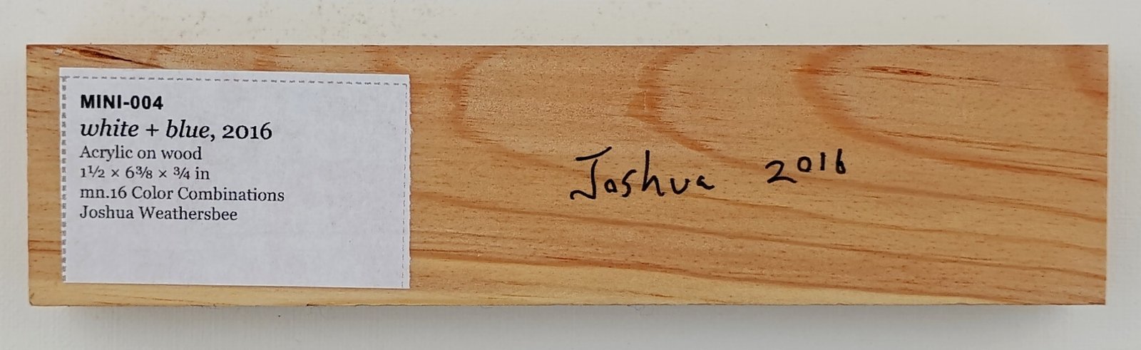 Back of white + blue, showing signature and label
