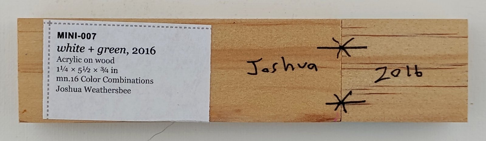 Back of white + green, showing signature and label