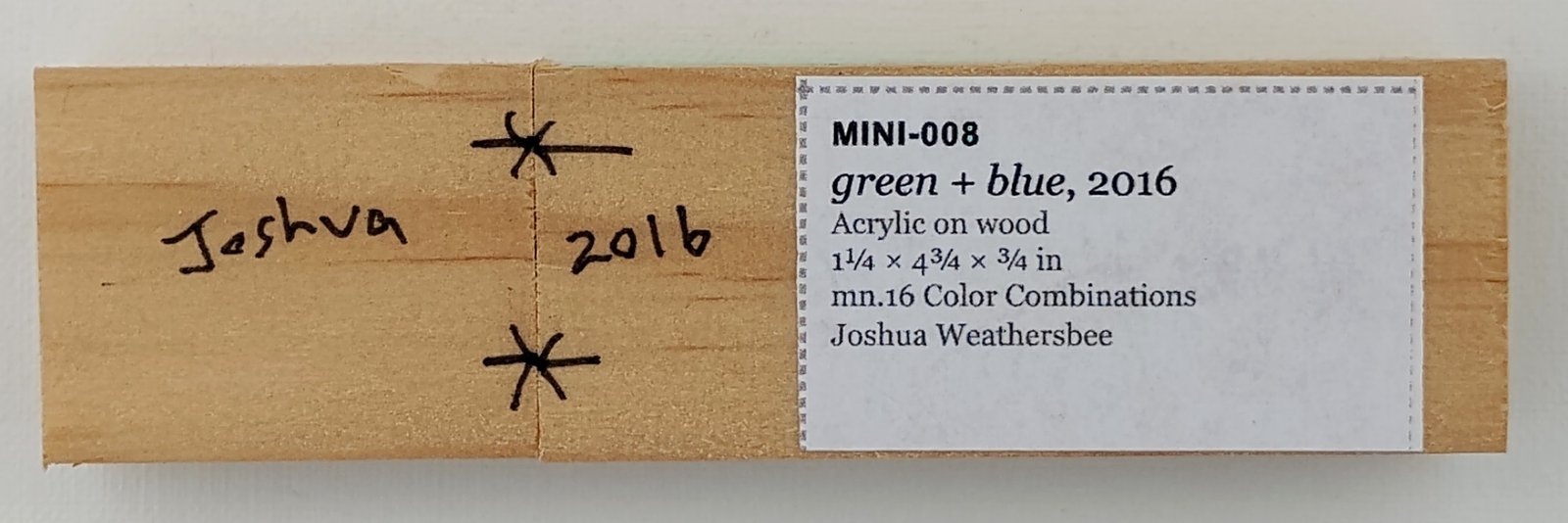 Back of green + white, showing signature and label