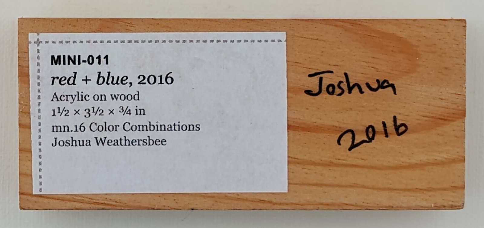 Back of red + blue, showing signature and label