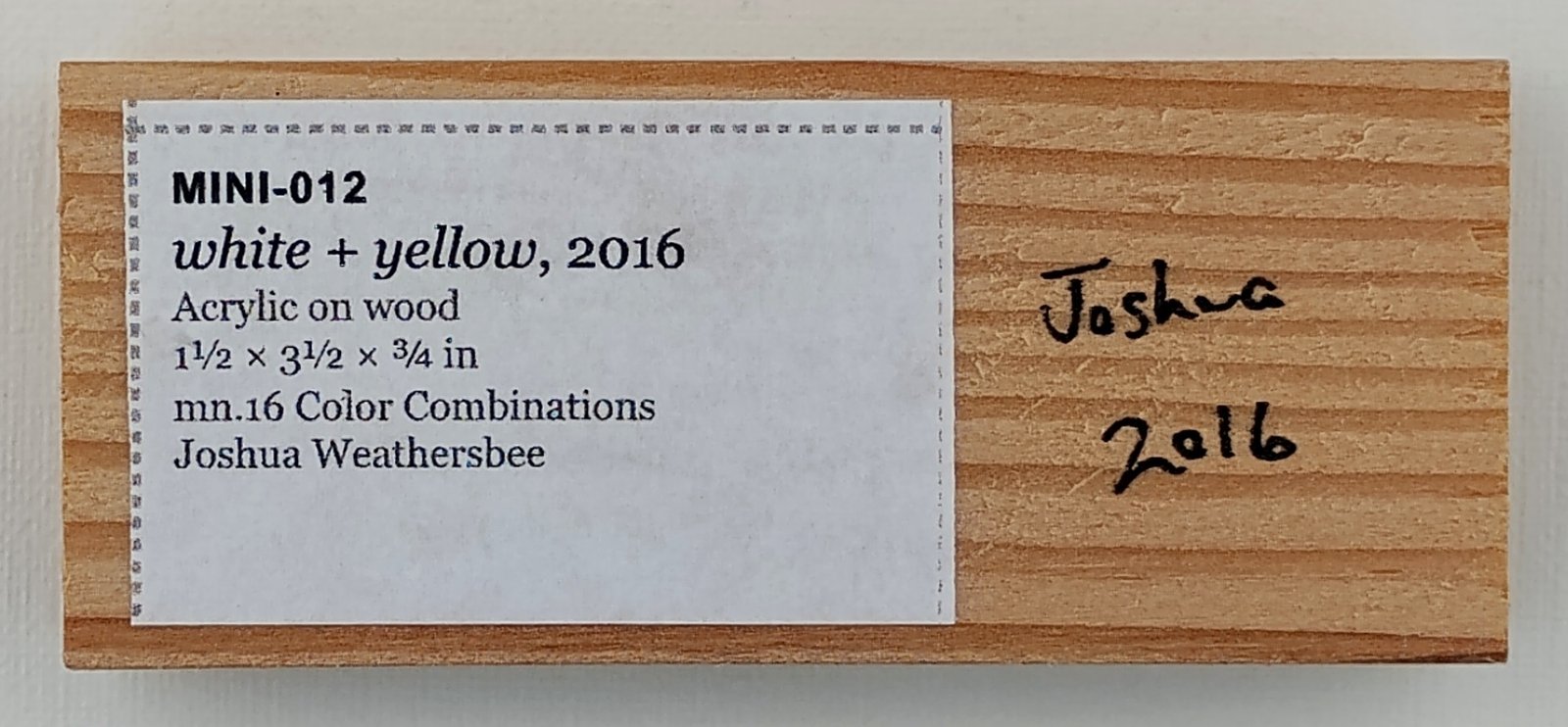 Back of white + yellow, showing signature and label